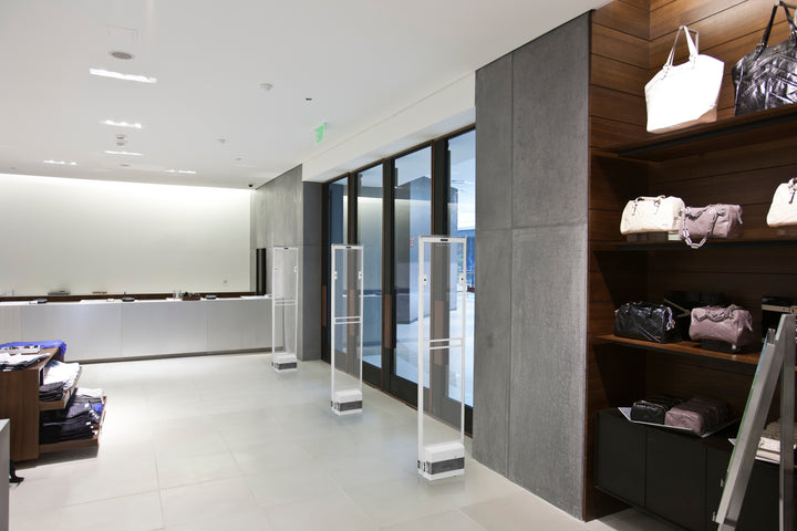 Electronic article surveillance pedestals at a retail entrance